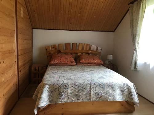 a bedroom with a large bed in a cabin at Під зорями in Slavske