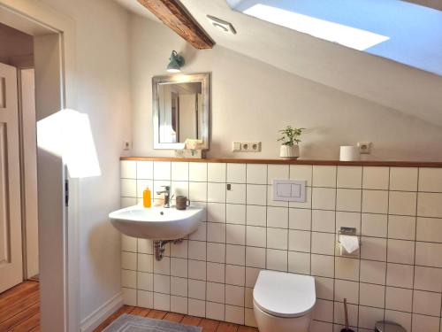 a bathroom with a sink and a toilet at Bahnhof Grombach in Bad Rappenau