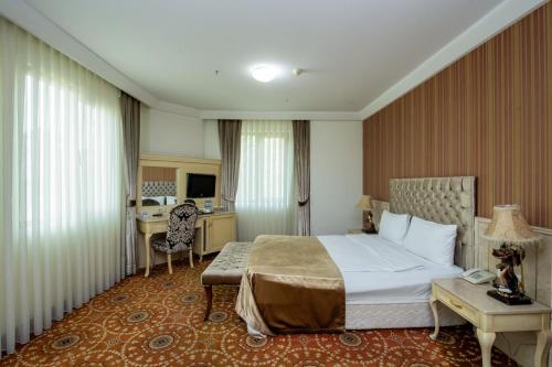 Postel nebo postele na pokoji v ubytování Atropat Boutique Hotel