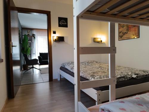 Ένα ή περισσότερα κρεβάτια σε δωμάτιο στο Altrove Leukerbad - Modern, Spacious & Central