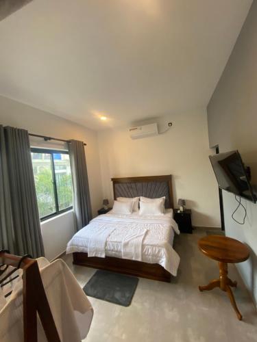 Postel nebo postele na pokoji v ubytování Villa Rowell