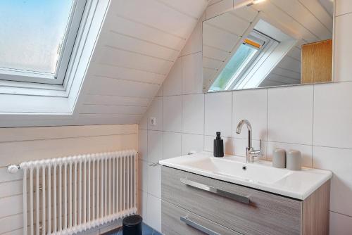 a bathroom with a sink and a mirror at Vogtadeshof in Wolfach
