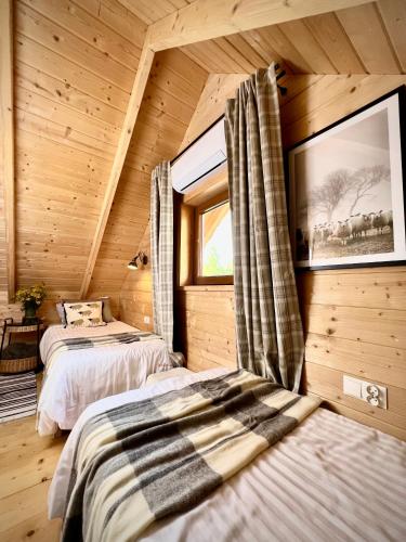 Postel nebo postele na pokoji v ubytování Domek pod wyciągiem, Tylicz