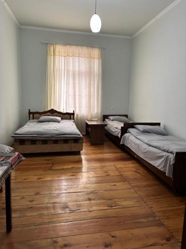 Postel nebo postele na pokoji v ubytování GO GOris city center