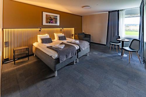 Postel nebo postele na pokoji v ubytování Kompassen