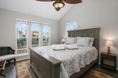 a bedroom with a bed with two pillows on it at Bayside Retreat Bring your boat private boat ramp at this fabulous bayfront home in League City