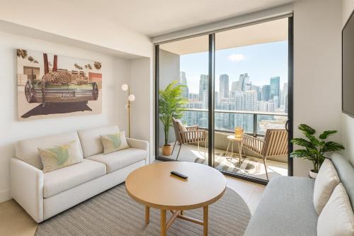 a living room with a couch and a table at Wonderful 1 Bed - Amazing views in Miami