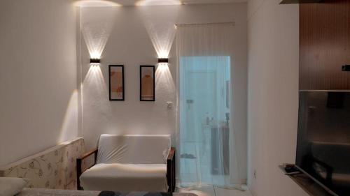 a bathroom with a shower and a glass door at Vista da praça Castro Alves in Salvador