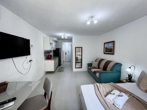 a living room with a bed and a couch at Skylux 405 e 603 in Rio de Janeiro