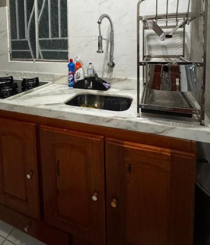 a kitchen counter with a sink in a kitchen at Refúgio na Floresta in Manaus