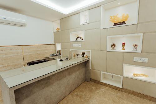 a kitchen with a counter and a sink at Hotel Keshav Residency - Medicity Gurugram, near Medanta Hospital in Gurgaon