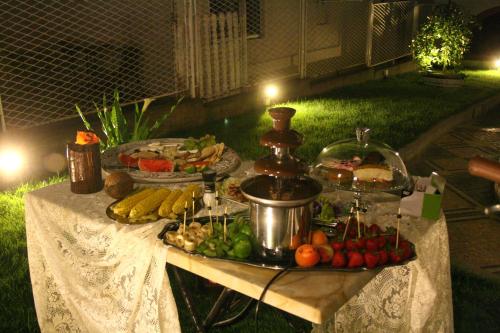 a table with a buffet of fruits and vegetables on it at French House in Belgrade
