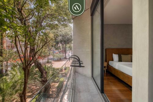 En eller flere senge i et værelse på Brand New 2 BR Condo in Roma Norte - Rooftop