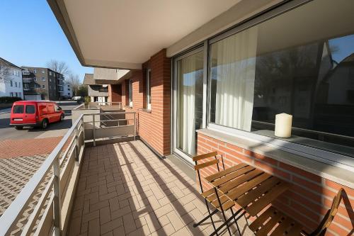 a balcony with two chairs and a window at Köln Pulheim 48 in Pulheim