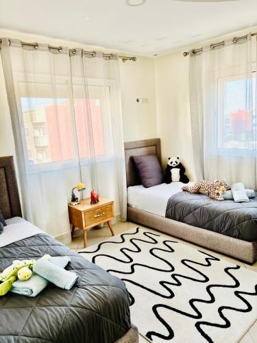 Ένα ή περισσότερα κρεβάτια σε δωμάτιο στο Cozy & family apartment in Mohammedia