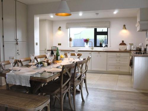 a kitchen and dining room with a table and chairs at Willow Lodge Cashel- Rock View-Sleeps 8 guests-Spacious- Cosy in Cashel