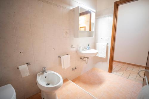 a bathroom with a toilet and a sink at La Torretta del Sementone in Assisi