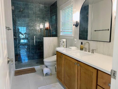 a bathroom with a sink and a toilet and a shower at Peaceful 3BR on 5 acres - Minutes from Nashville in Joelton