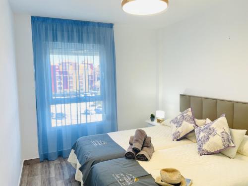 Ένα ή περισσότερα κρεβάτια σε δωμάτιο στο Apartamento Brisa de Laguna en Torrox Costa
