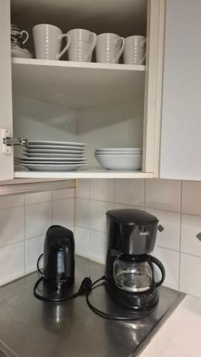 a coffee maker sitting on top of a kitchen counter at Studio at Tottinkatu in Savonlinna
