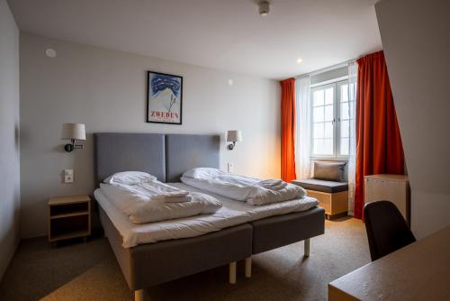 Ένα ή περισσότερα κρεβάτια σε δωμάτιο στο Tott studios