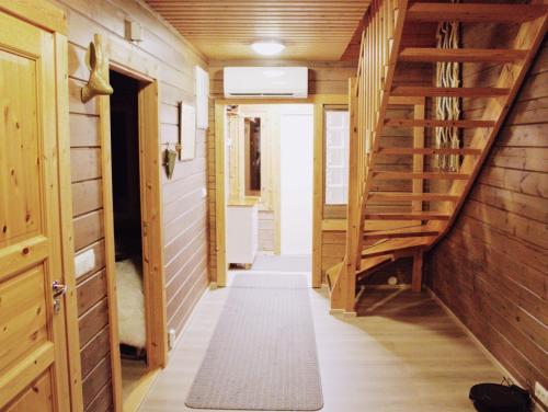 a hallway with wooden stairs in a house at Private Villa At Lake 