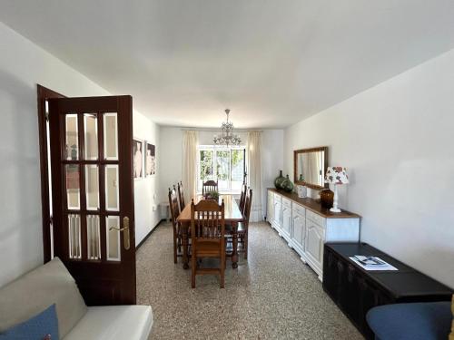 a living room with a table and a dining room at Casa Pancha in Ribadeo
