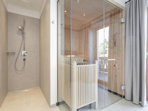 a shower with a glass door in a bathroom at Stöffler Haus Top 2 in Tamsweg