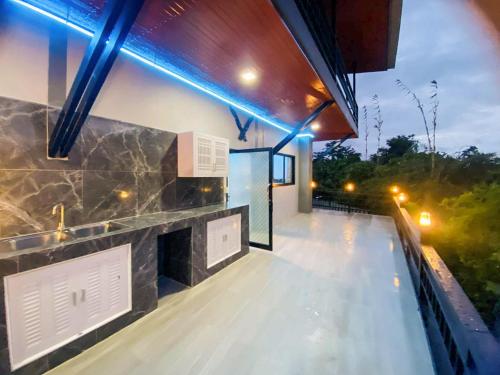 a house with a fireplace on a roof with lights at Thawat Villa Boutique Resort in Ko Lanta