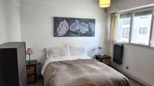 En eller flere senge i et værelse på Centro con Vista al lago