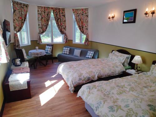 Postel nebo postele na pokoji v ubytování Utena Izukogen