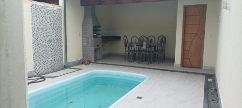 a swimming pool in the middle of a patio with chairs at Casa Sol in Prado