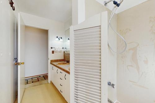 a bathroom with a staircase leading to a shower at West End Wanderlust in Eureka