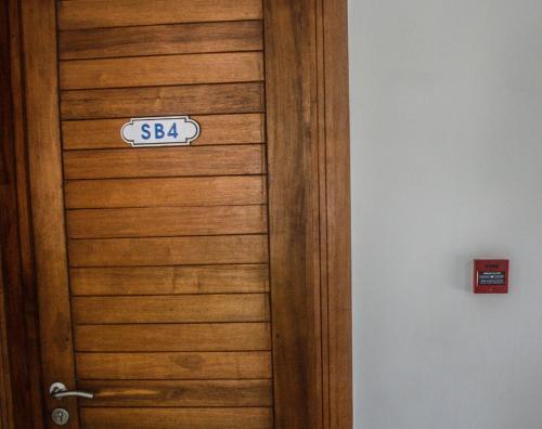 a wooden door with a sign on it at Toi Et Moi in Bain Boeuf