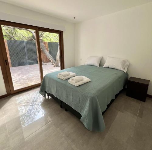 Letto o letti in una camera di Departamento a estrenar cerca de la Avenida Principal en El Calafate