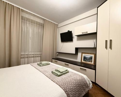 Ένα ή περισσότερα κρεβάτια σε δωμάτιο στο Cozy