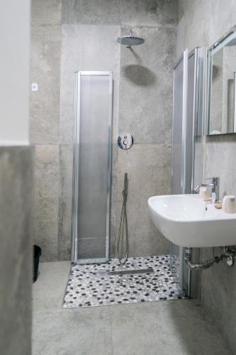 a bathroom with a shower and a sink at Residence la Pace - Pool & Relax in Marina di Grosseto