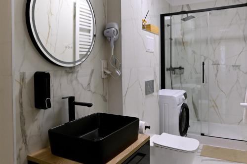 Et badeværelse på Apartamenty Milano