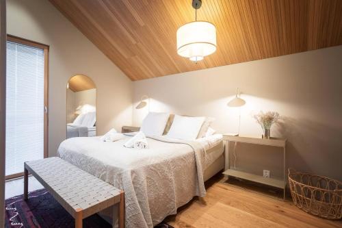 Postel nebo postele na pokoji v ubytování Joiku - Kaira