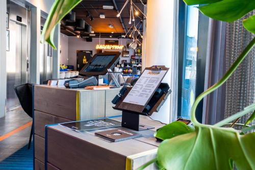 a shop with a counter with a cash register at Comfort Hotel Xpress Tromsø in Tromsø