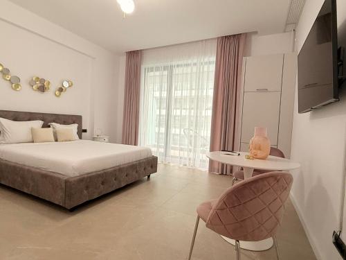 En eller flere senge i et værelse på Holidays Sea Vibes One