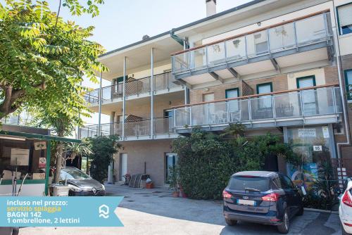 a car parked in front of a building with a balcony at Appartamento a Senigallia in Lungomare Da Vinci - SE006 in Senigallia