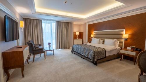 Postel nebo postele na pokoji v ubytování ALUSSO THERMAL HOTEL SPA