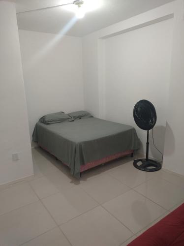 Postel nebo postele na pokoji v ubytování Kitnet em São Brás