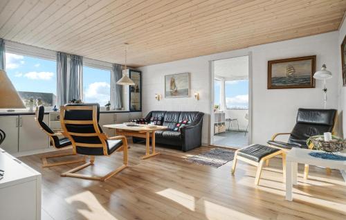 a living room with a couch and a table at Amazing Home In Snedsted With Wifi in Skyum