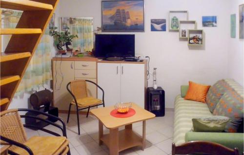 a living room with a couch and a table at Beautiful Home In Bol in Bol