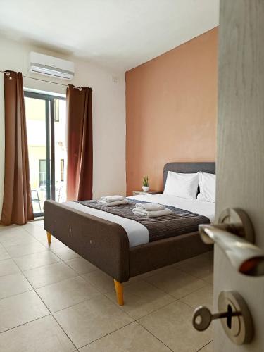 a bedroom with a large bed in a room at Sliema 3 bedrooms apartment in Sliema