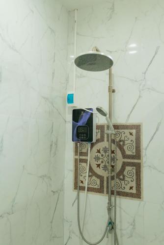 a shower in a bathroom with a light and a shower at Baan Viset Pool Villa Krabi in Ao Nang Beach