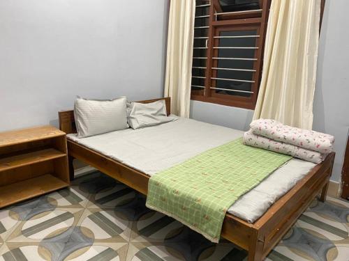 Postel nebo postele na pokoji v ubytování Sirful Homestay