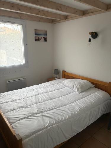 Ένα ή περισσότερα κρεβάτια σε δωμάτιο στο Petite perle